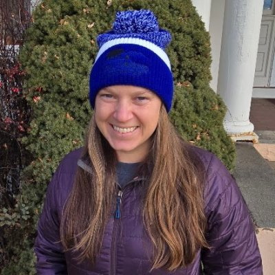 Image of woman wearing a blue and white knit beanie