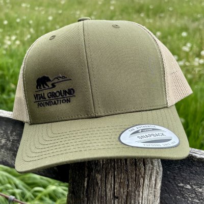 Green trucker hat with a black Vital Ground logo