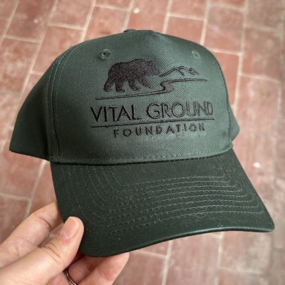 forest green hat featuring a black Vital Ground Logo